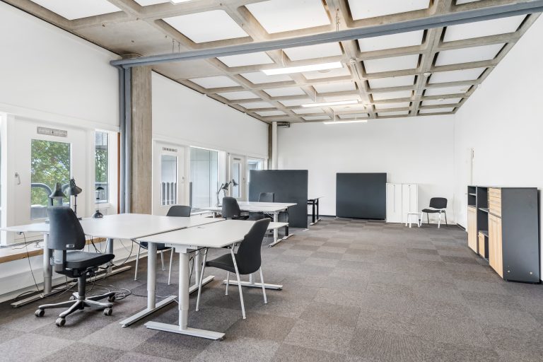 Office 4.16 with desks, office chairs and large windows