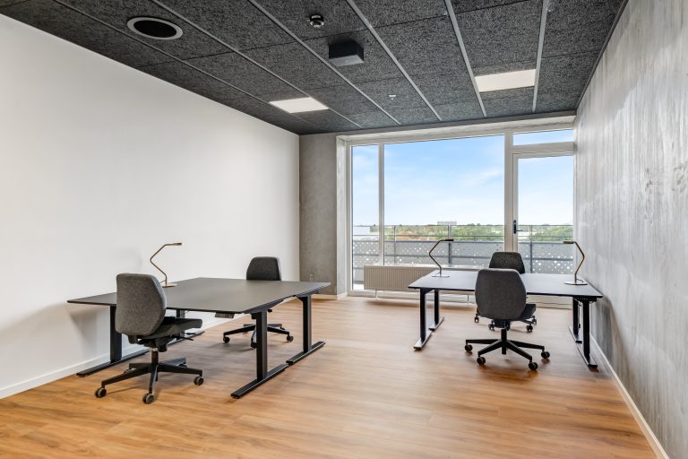 Office unit H5.18 with desks and views from the high-rise