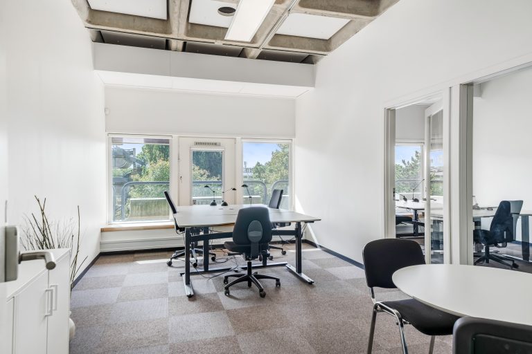 Bright six-person office 2.13 with desks and meeting table